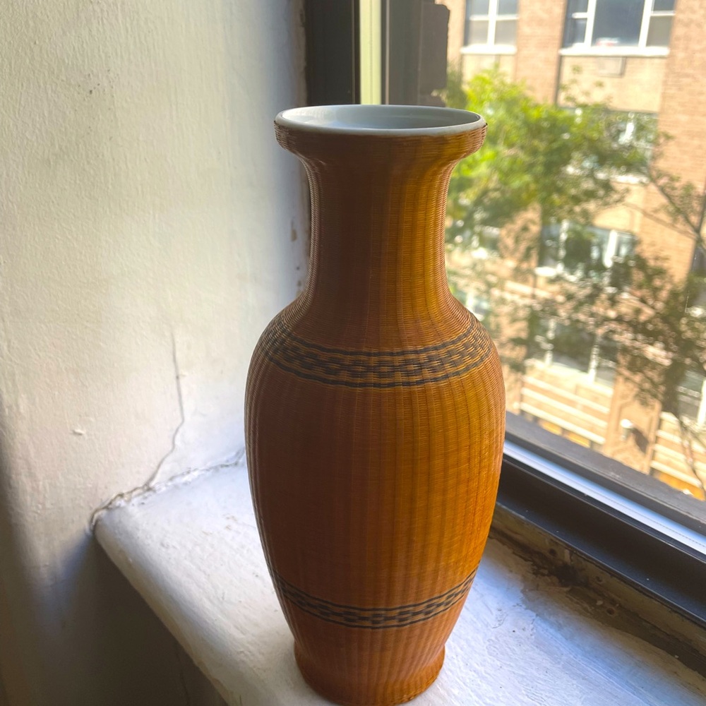 Vintage woven bamboo over porcelain vase